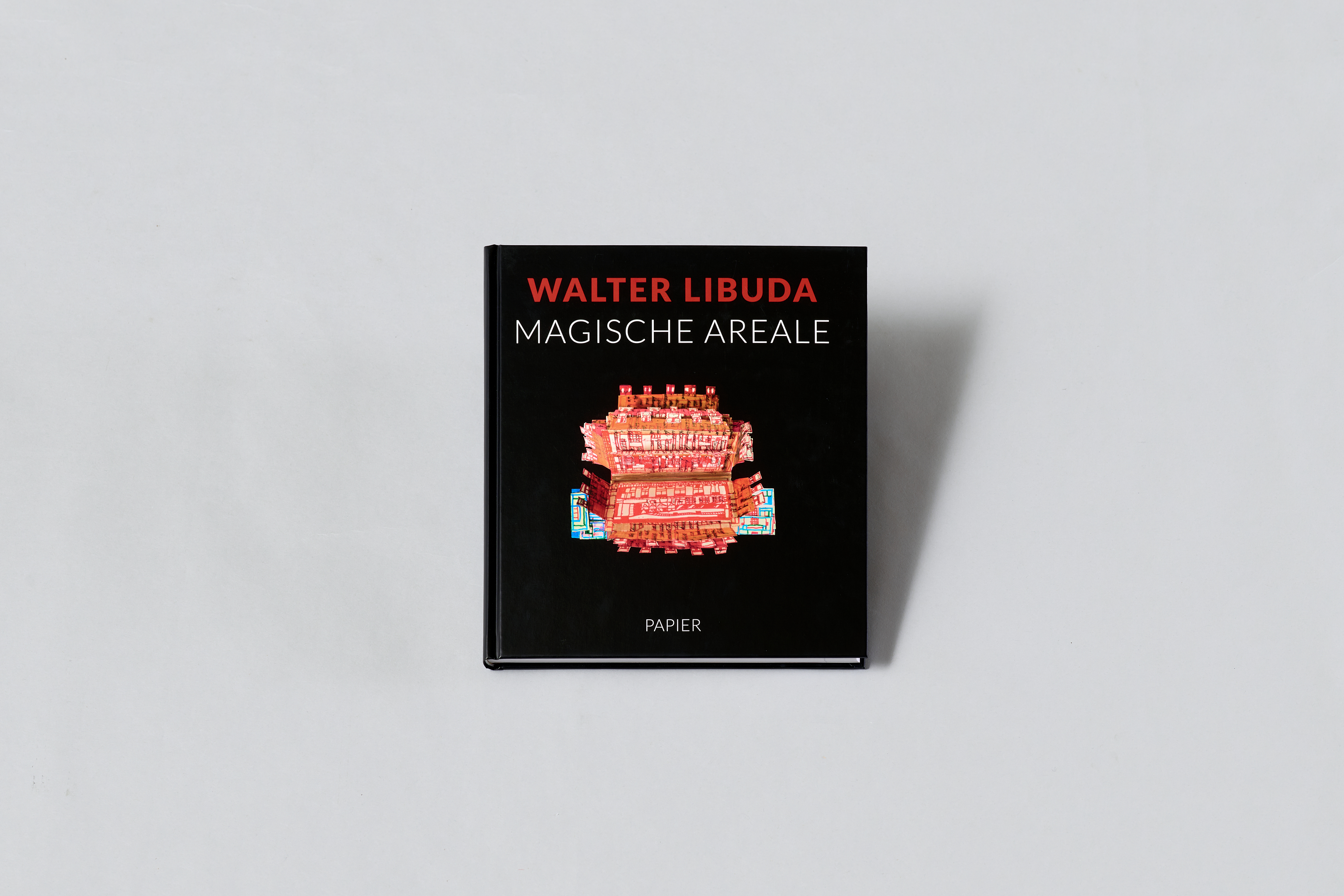 AI generated: The image shows the cover of a book entitled "Walter Libuda: Magische Areale". It presents a colourful work of art on a black background.