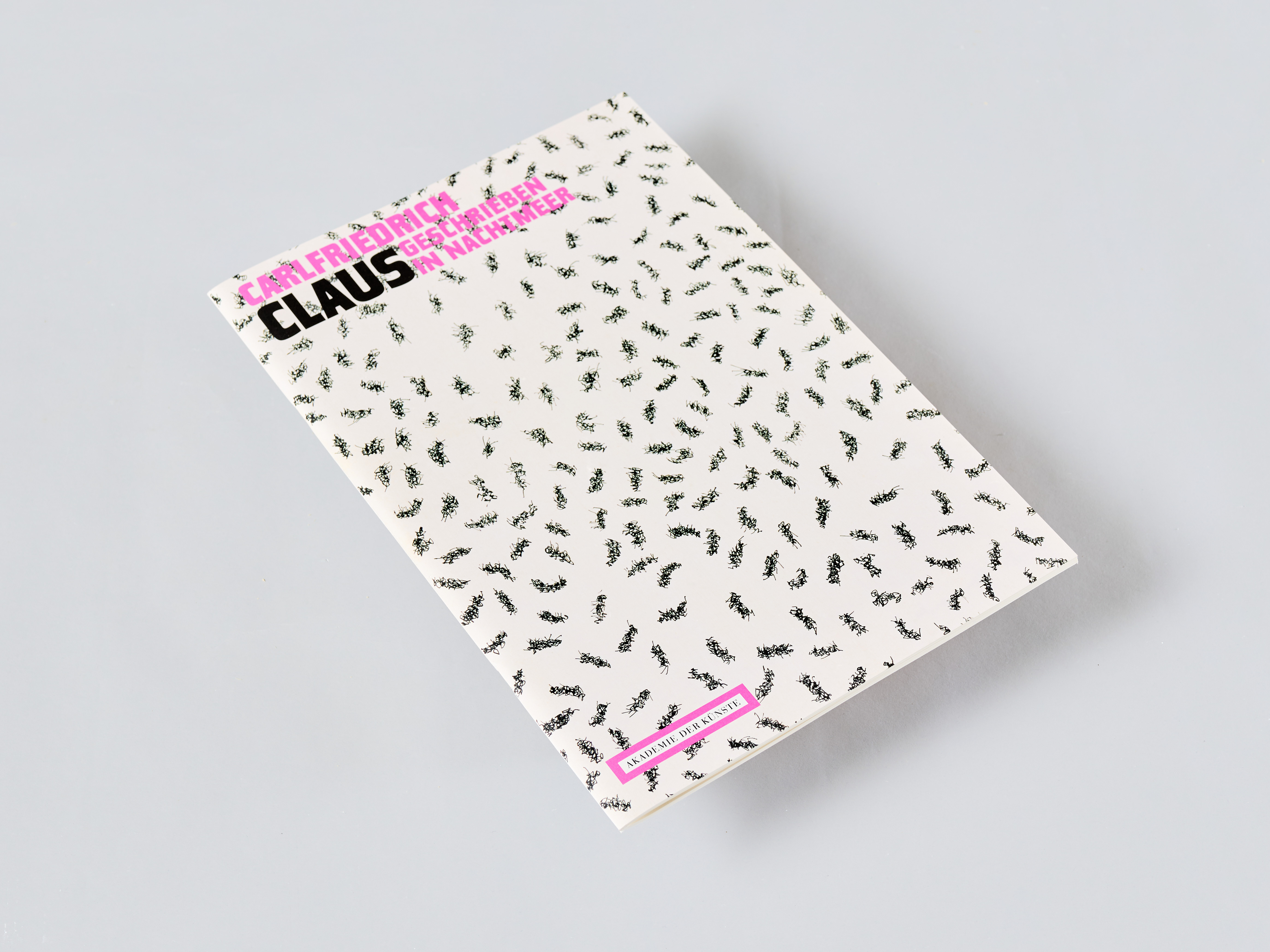 AI generated: The image shows a book with a cover covered by numerous small black ant motifs on a white background. The title of the book is printed in black and pink.