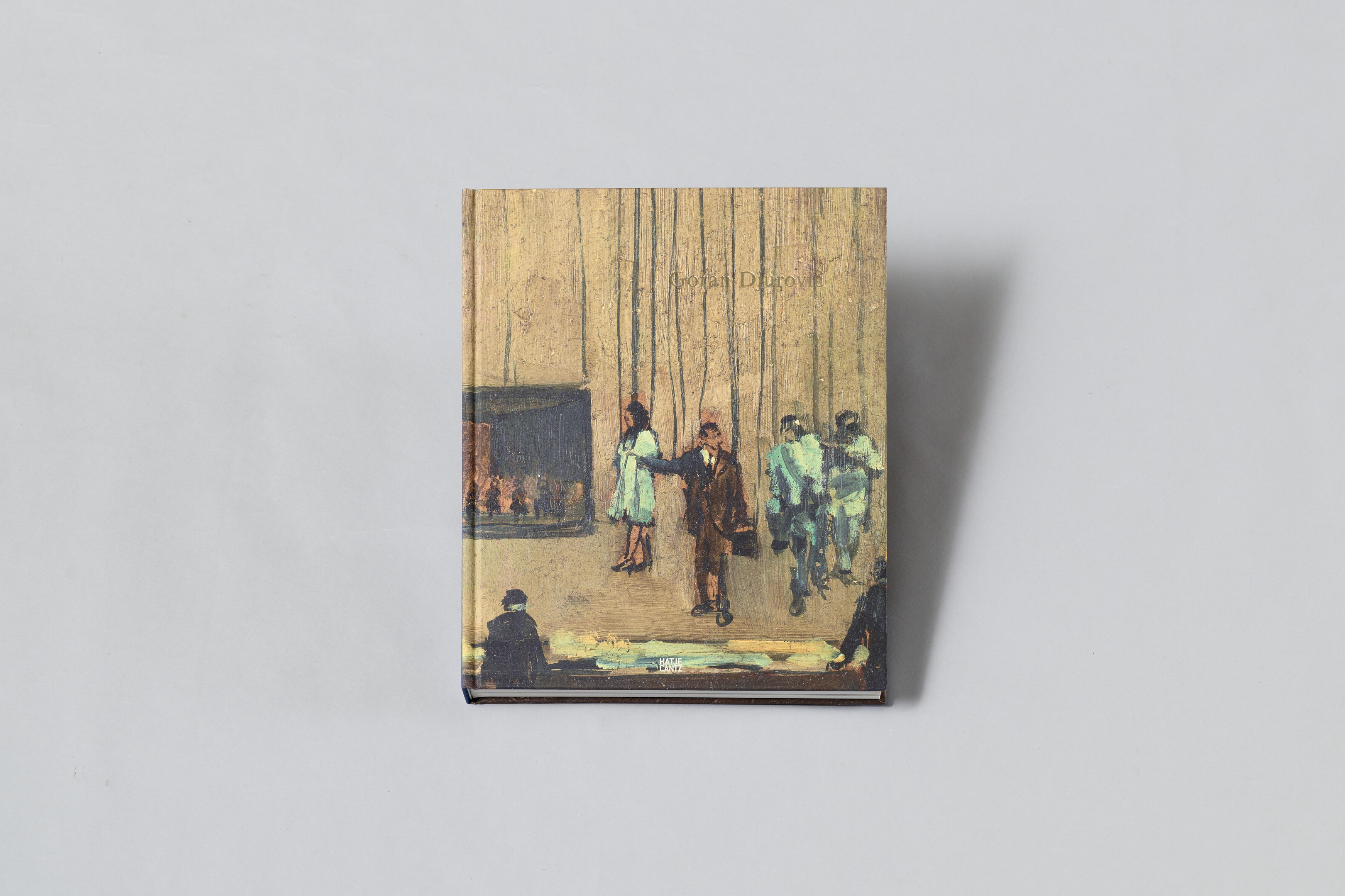 AI generated: The image shows a book with a cover depicting a scene from a theatre or a performance where people can be seen on a stage. The scene is in an impressionistic style.