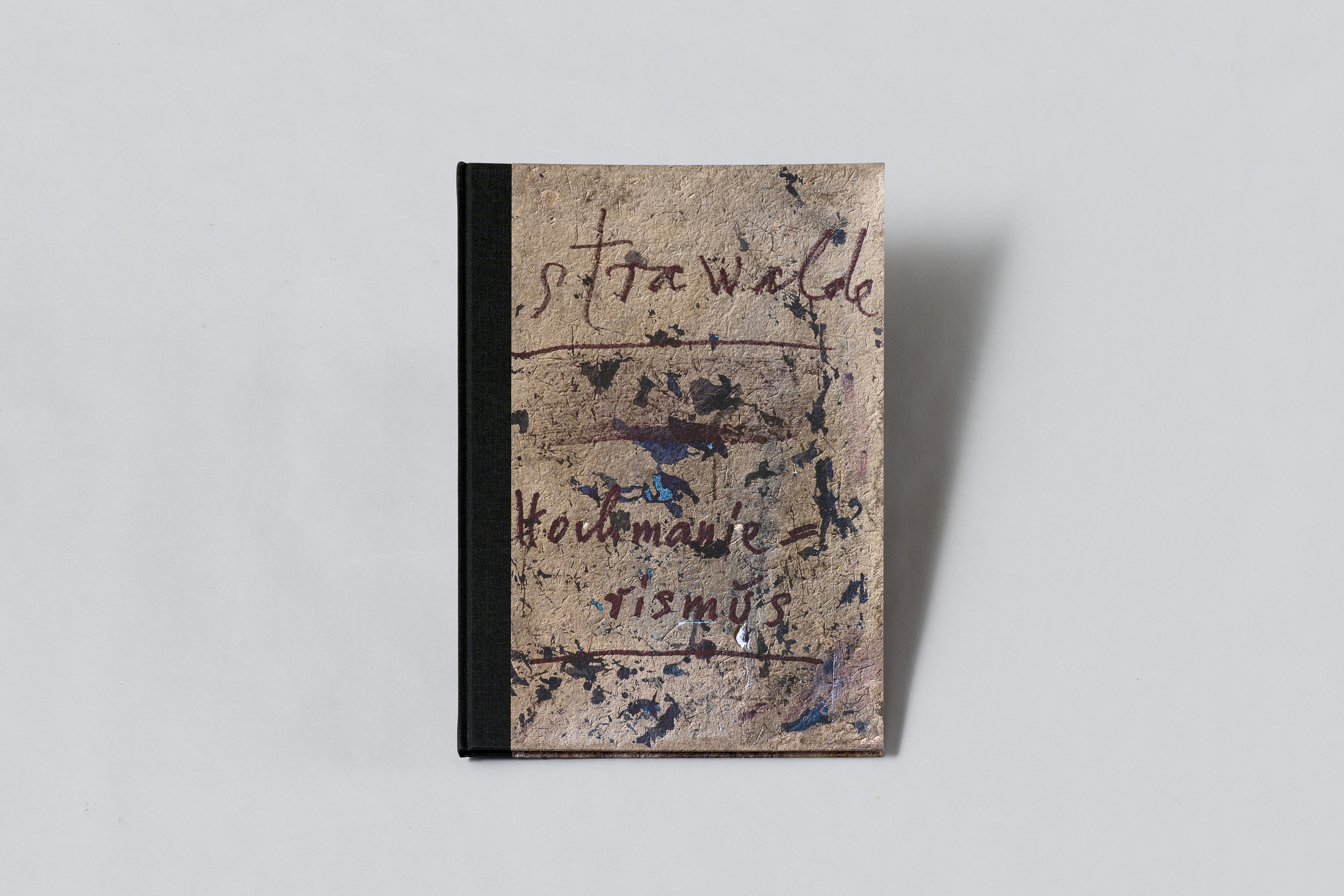 AI generated: The image shows a square book with a rustic, artistic cover featuring handwritten text and coloured spots. The cover appears to be painted or sketched, giving the book a handmade, artistic look.