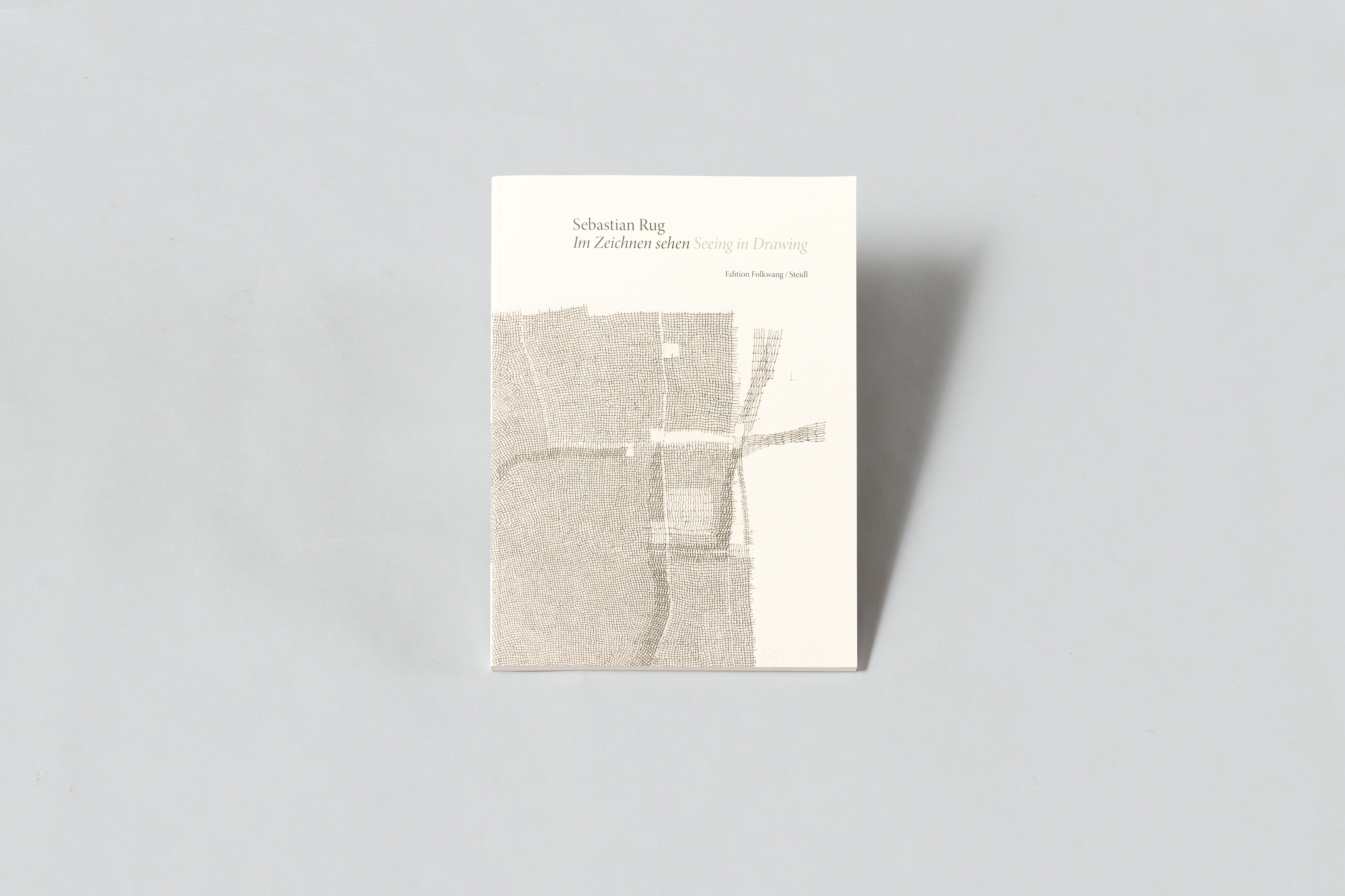 KI generiert: Das Bild zeigt das Buch "Im Zeichnen sehen" von Sebastian Rug. Das Cover ist mit einem abstrakten Muster gestaltet.