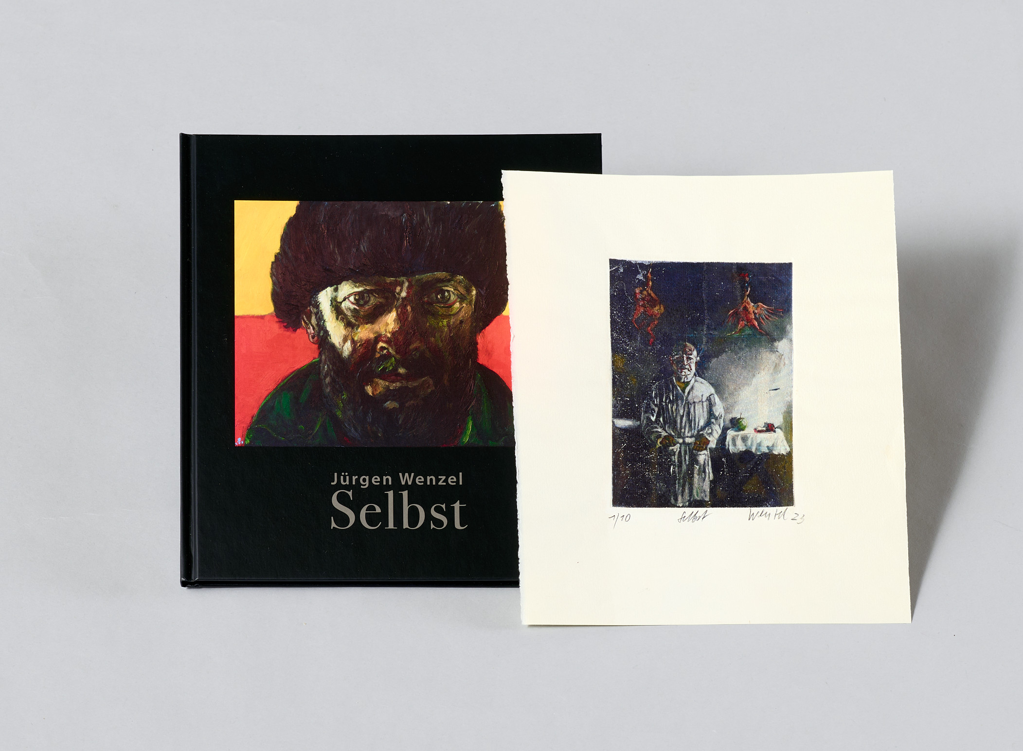 AI generated: The image shows a book entitled "Self" by Jürgen Wenzel next to an art print. The art print shows a colourful depiction of a figure in an artistic scene.